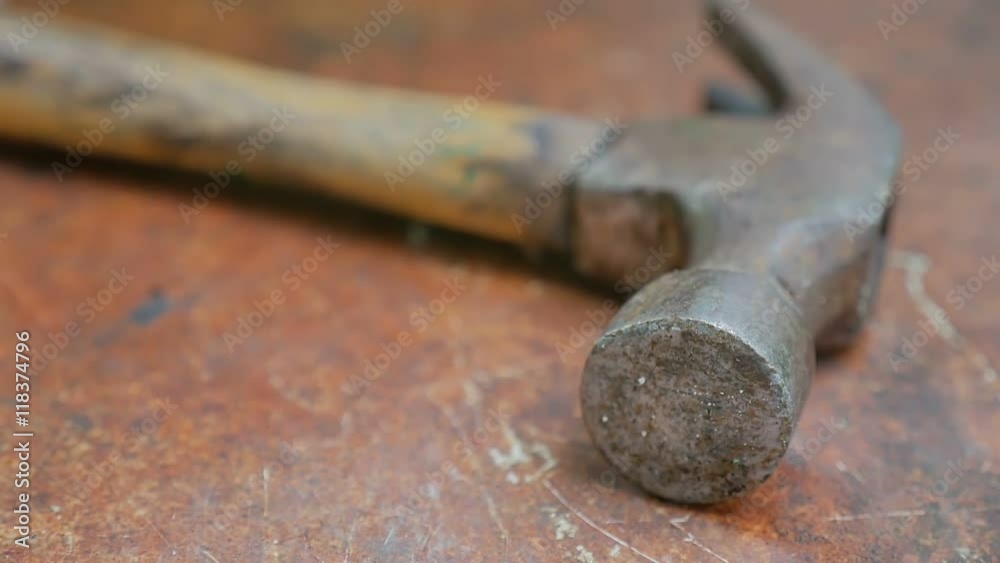 old rusty hammer on iron sheet slow motion video old rusty hammer on iron sheet slow motion video