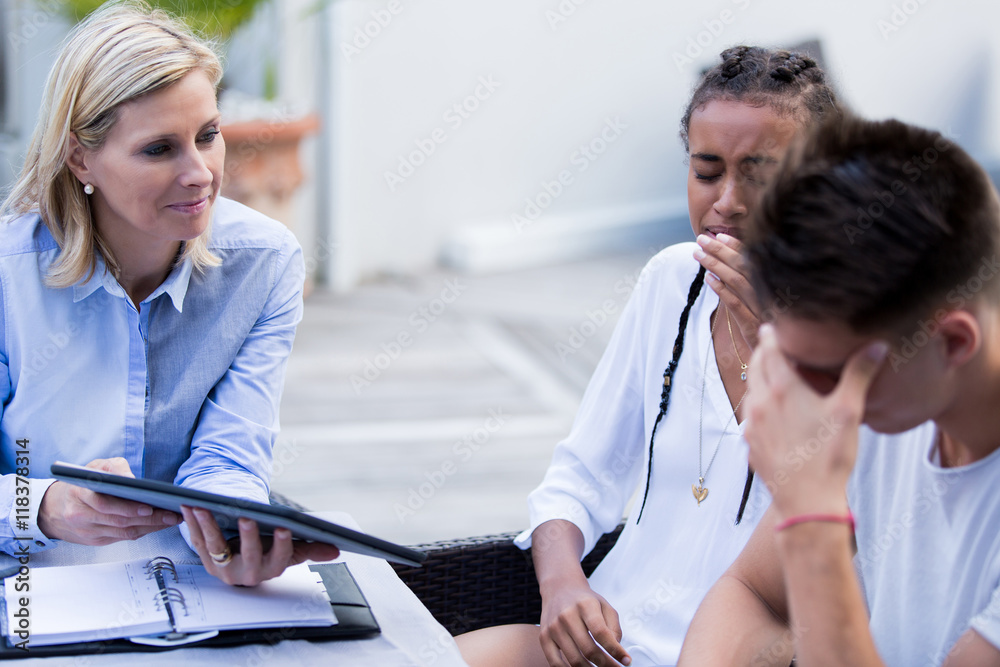 couple crying with agent couple crying with agent