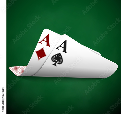 Ace of diamonds, ace of spades. Curved cards on green cloth.