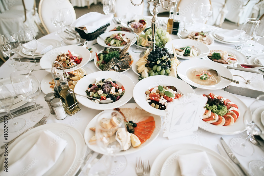 Fototapeta premium catering service. table with food and drink at restaurant before wedding party