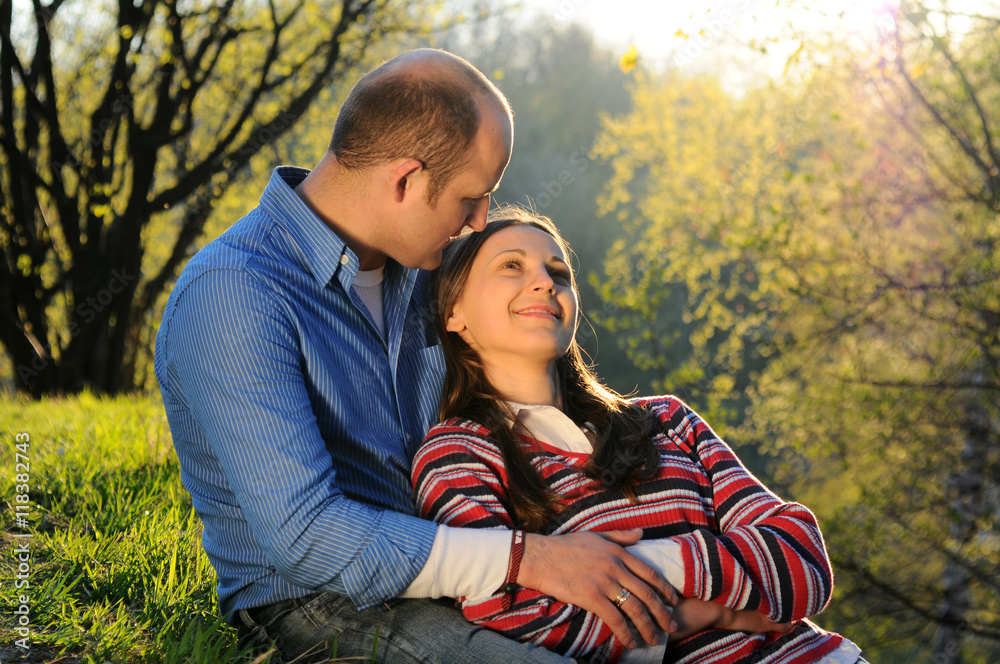 Fototapeta premium Nice young couple sitting and hugging in park, Love story,Relationship