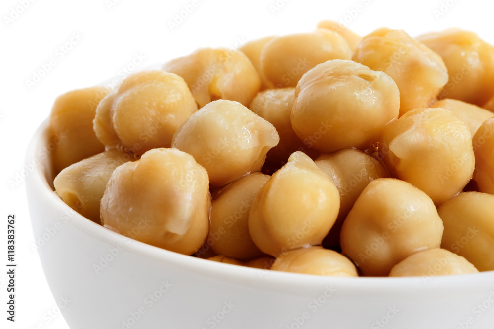 Detail of cooked chickpeas in white bowl on white. Detail of cooked chickpeas in white bowl on white.