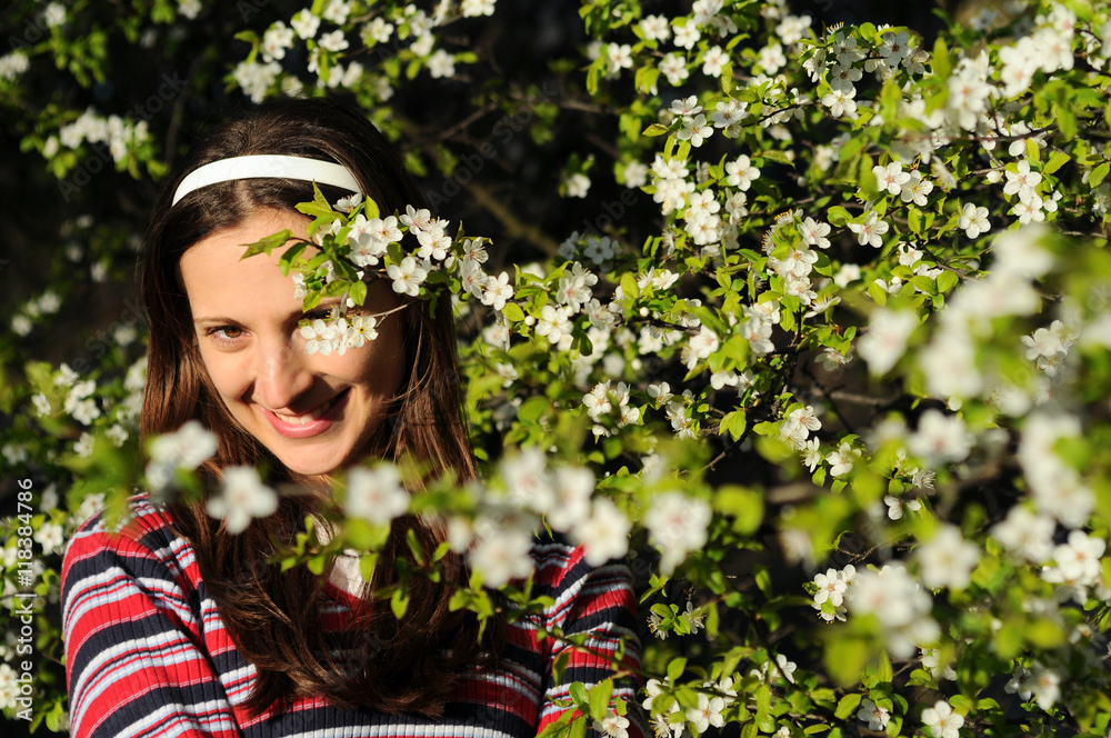 Beautiful young woman enjoying sunny day in park during blossom season on a nice spring day
Beautiful young woman enjoying sunny day in park during blossom season on a nice spring day