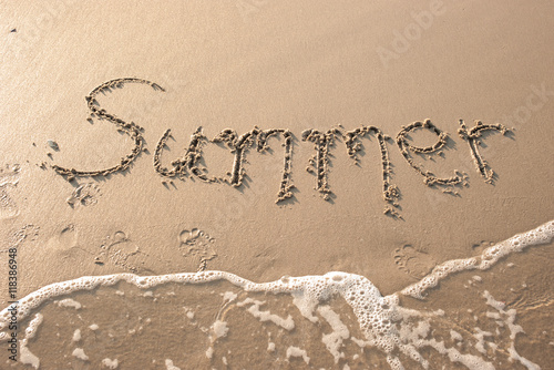 "Summer" written in sand beach