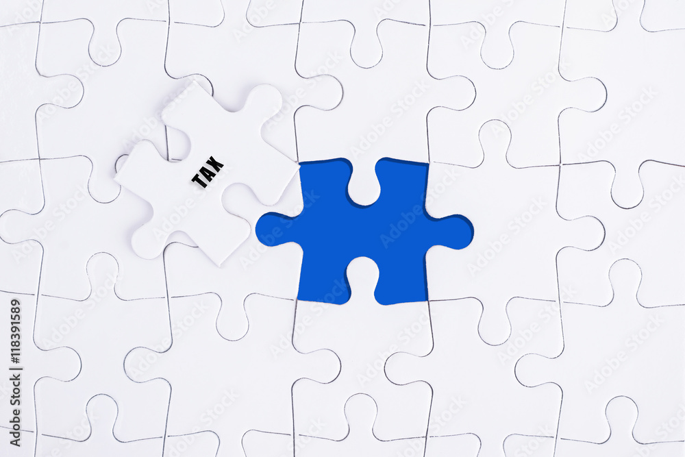 TAX WORD, WHITE AND BLUE MISSING PUZZLE WITH COPY SPACE AREA. TAX WORD, WHITE AND BLUE MISSING PUZZLE WITH COPY SPACE AREA.