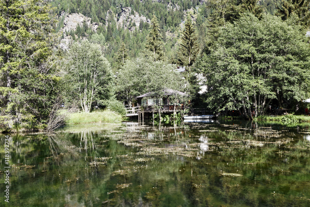 Obraz premium Placid alpine lake in Champoluc, Italy