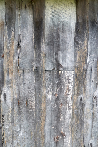 wooden wall made from old boards grey color of different wood species