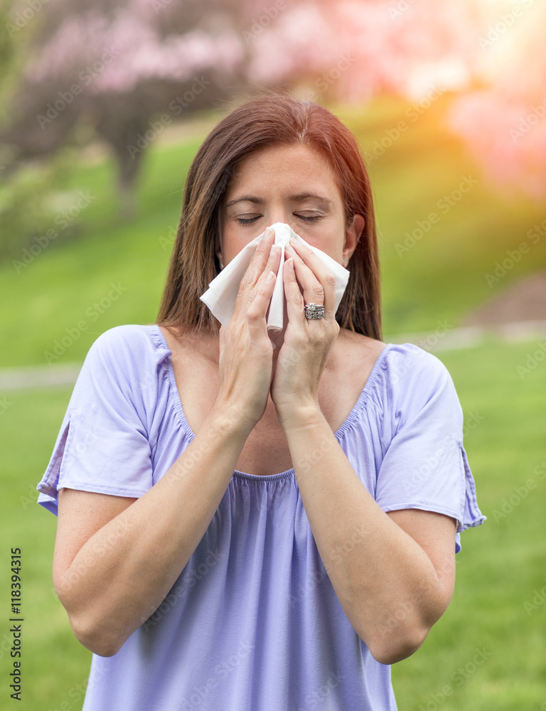 Woman blowing nose Woman blowing nose
