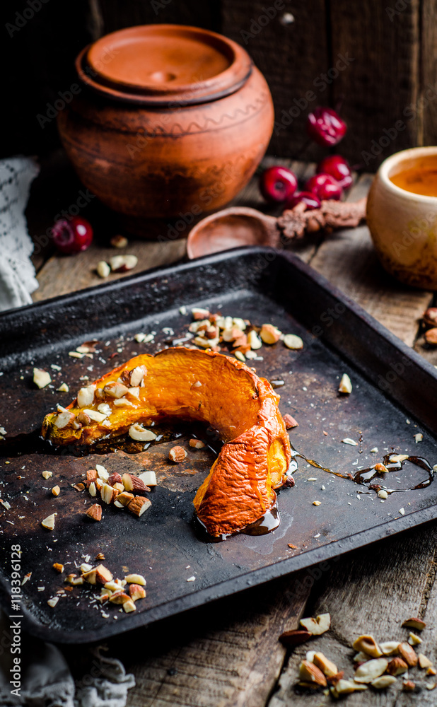 Baked pumpkin slices with honey and nuts,healthy dessert, autumn concept
