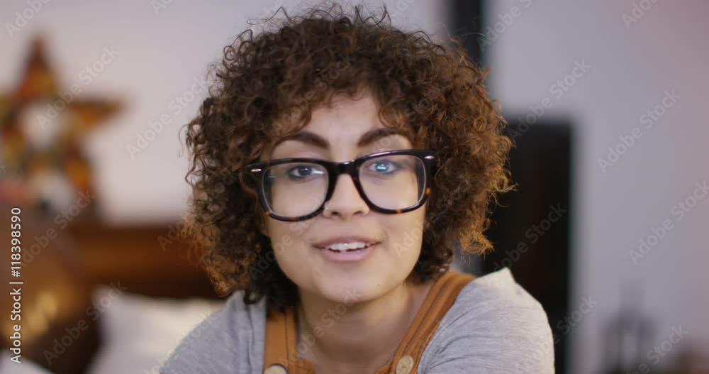  Young woman at home, making a video call on computer