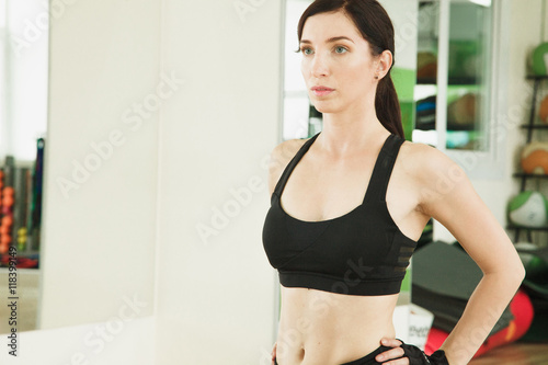 young athletic girl on training in a fitness club