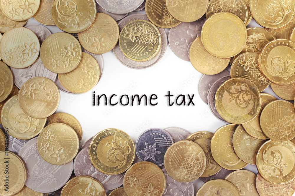 Background of the gold coin with word income tax in the middle. Background of the gold coin with word income tax in the middle.