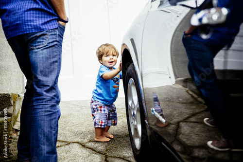 Father and baby son washing car photo