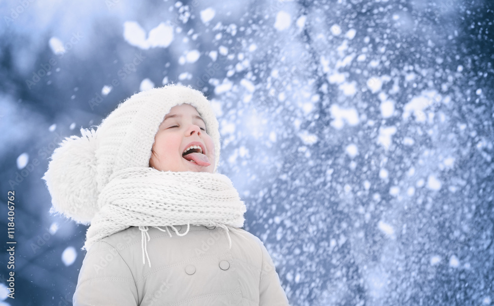 Fototapeta premium Cute girl outdoor in winter. Winter holiday concept.