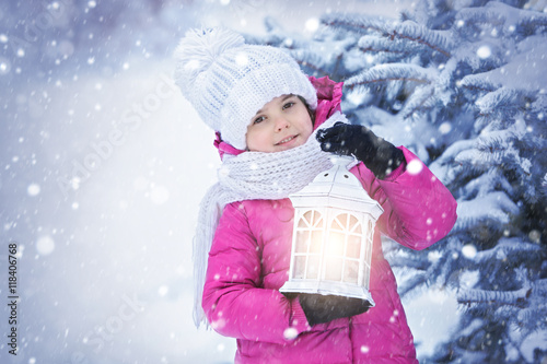 Cute girl with lantern outd...
