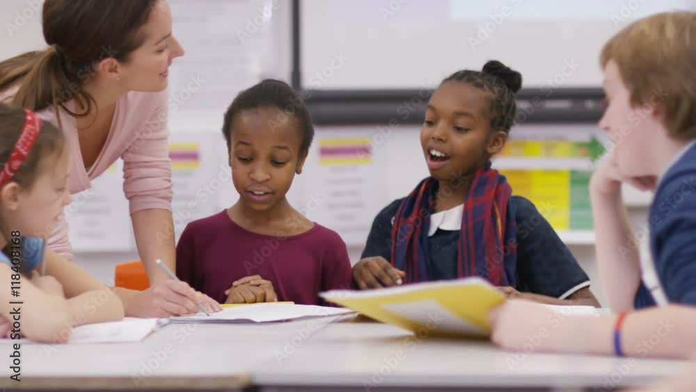  Teacher working with young pupils in school lesson
