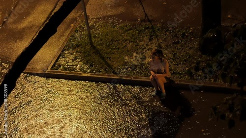 Sad girl in the rain. 4K UHD