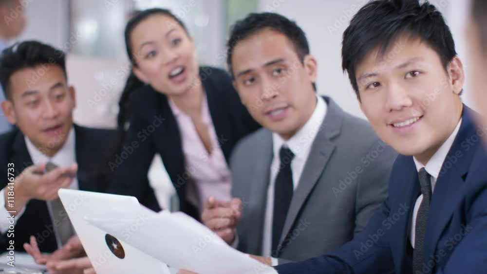Asian corporate business group in discussion in business meeting Asian corporate business group in discussion in business meeting