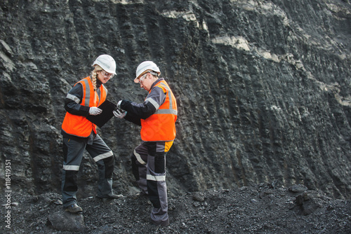 Fotografering Workers with coal at open pit