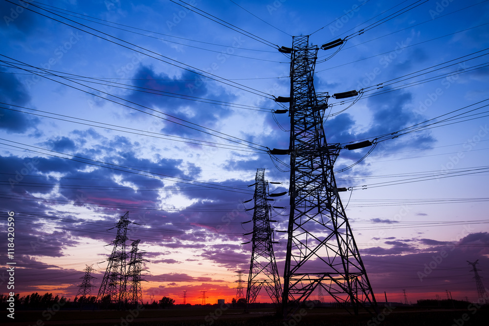 The silhouette of the evening electricity transmission pylon The silhouette of the evening electricity transmission pylon