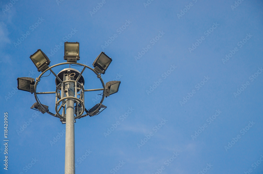 spotlights electric poles with blue sky background