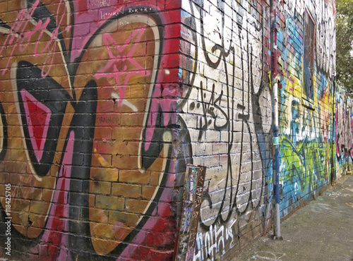 colourful graffiti or street art on a building by an unknown artist