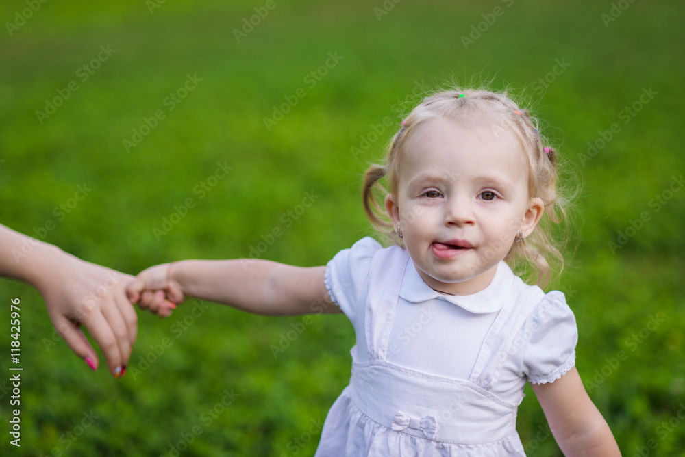 very emotional little girl walks in the summer park very emotional little girl walks in the summer park