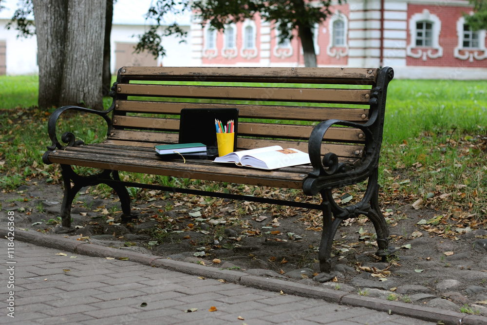 books on a bench in the school year
