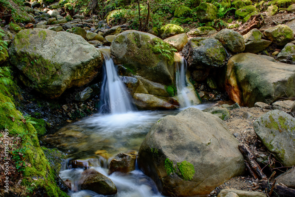 Attractive Waterfall and Green Moss Stone In Forest Attractive Waterfall and Green Moss Stone In Forest