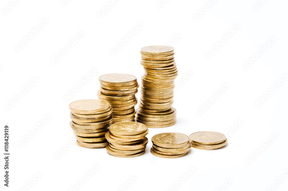 Several piles of monetary coins on a white background. Financial concept of investments and savings valuable metafishing. It is isolated on a white background. Several piles of monetary coins on a white background. Financial concept of investments and savings valuable metafishing. It is isolated on a white background.