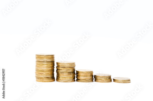 Several piles of monetary coins on a white background. Financial concept of investments and savings valuable metafishing. It is isolated on a white background.