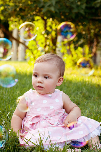Beautiful baby with soap bubbles