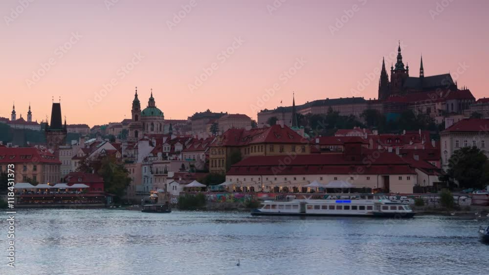 Czech Republic. Prague. Evening. View of the Vltava river with pleasure boats and city in background the Cathedral of St. Vitas. Time lapse 4K Czech Republic. Prague. Evening. View of the Vltava river with pleasure boats and city in background the Cathedral of St. Vitas. Time lapse 4K