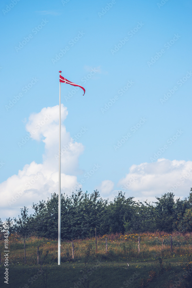 Pennant in danish colors on a lawn