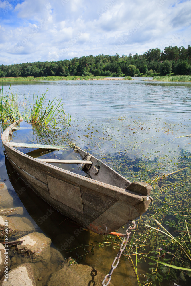 Chained wooden rowing boat