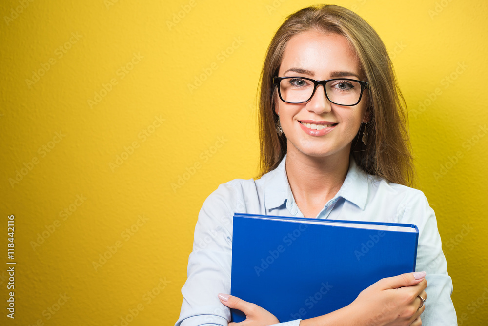 Cute business woman in spectacles holding a folder Cute business woman in spectacles holding a folder