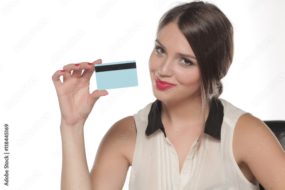 beautiful young woman holding a credit card in her hand. beautiful young woman holding a credit card in her hand.