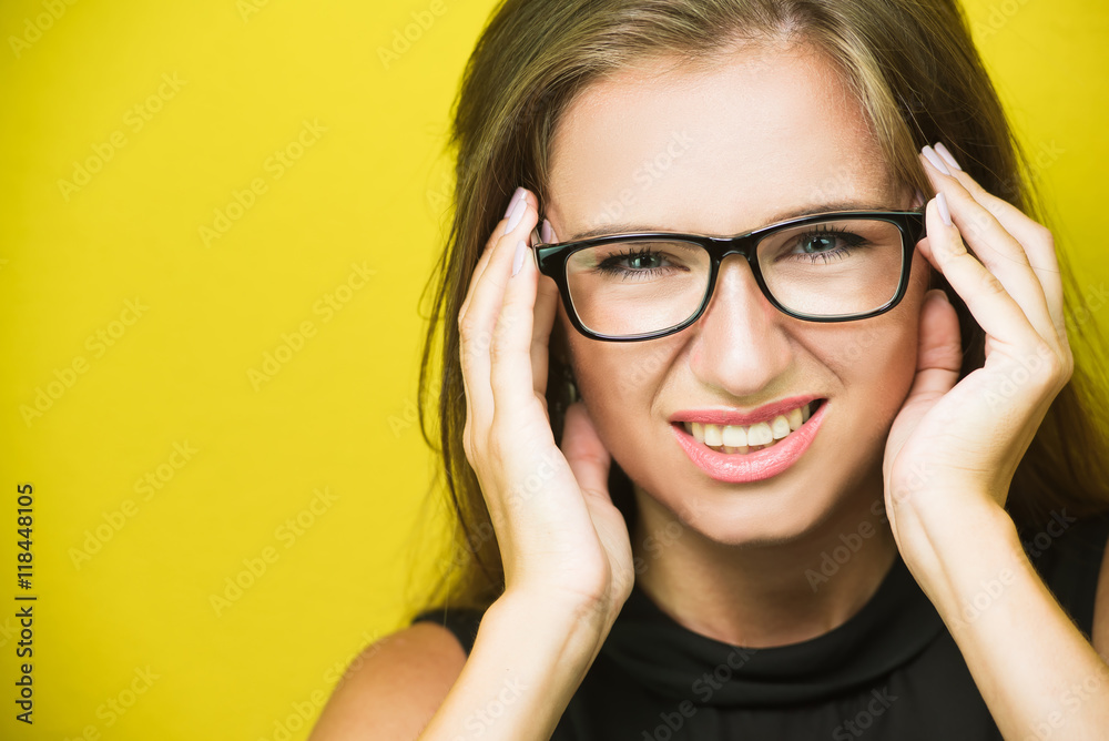 Young tired female office worker suffering headache