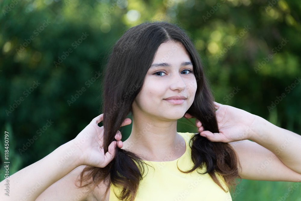 girl holds her hair in hands girl holds her hair in hands
