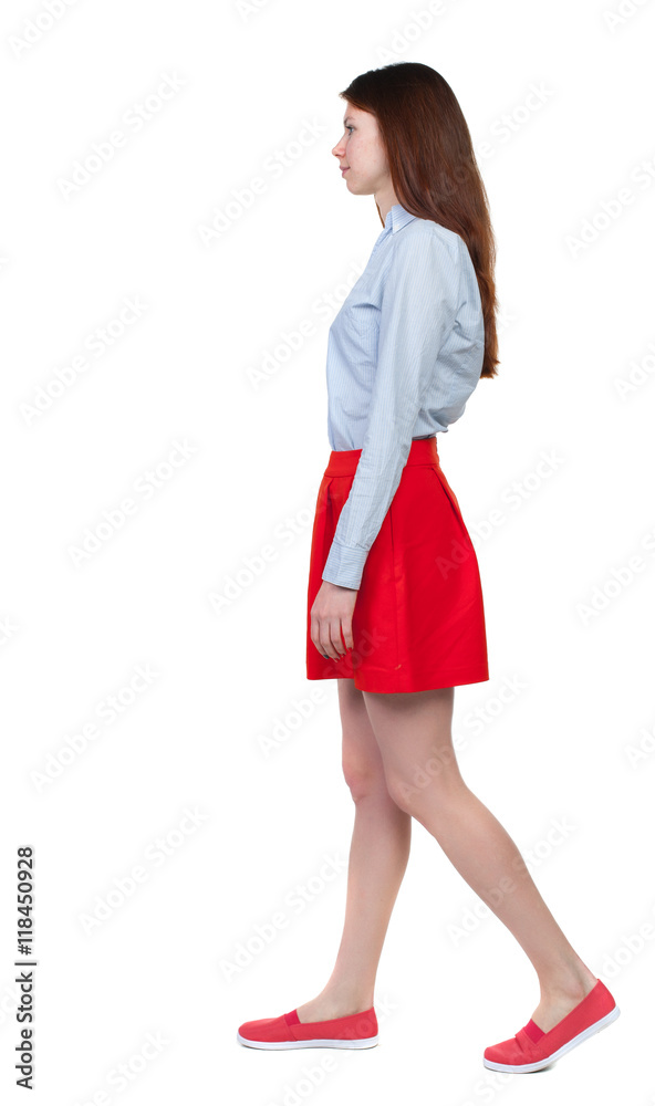 back view of walking woman. beautiful blonde girl in motion. backside view of person. Rear view people collection. Isolated over white background. Long-haired brunette in red skirt is a sad side. back view of walking woman. beautiful blonde girl in motion. backside view of person. Rear view people collection. Isolated over white background. Long-haired brunette in red skirt is a sad side.