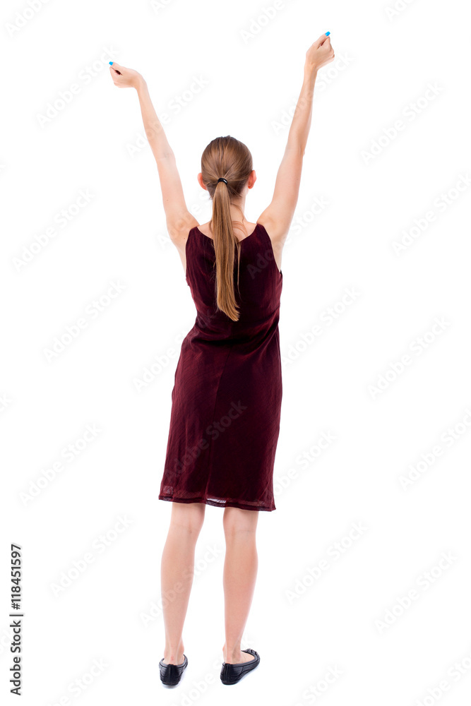 Back view of  woman.  Raised his fist up in victory sign.    Raised his fist up in victory sign.  Rear view people collection.  backside view of person.  Isolated over white background. A girl in a