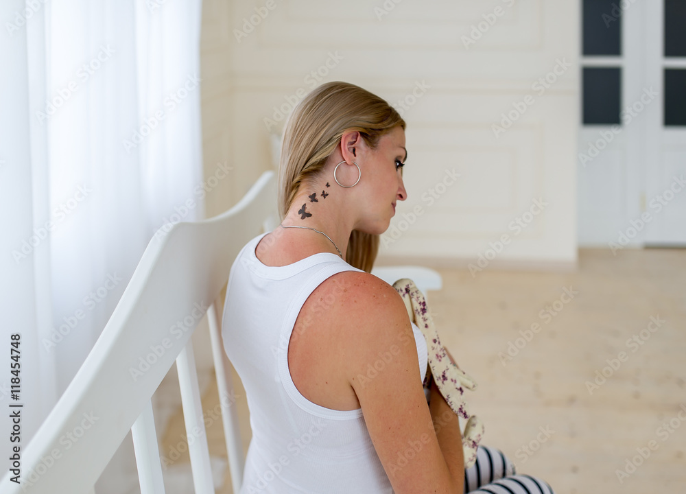 The charming pregnant woman with a tattoo of butterflies.