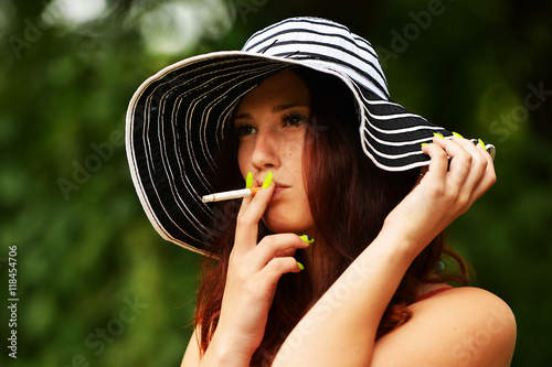 woman smoking in the forest