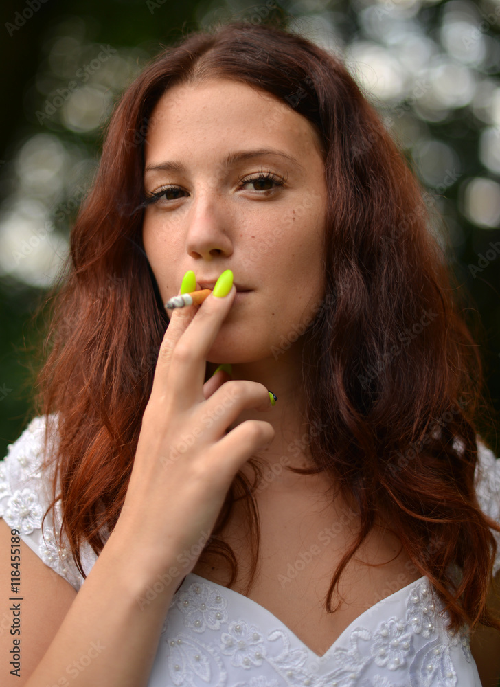 Smoking woman with a cigarette Smoking woman with a cigarette