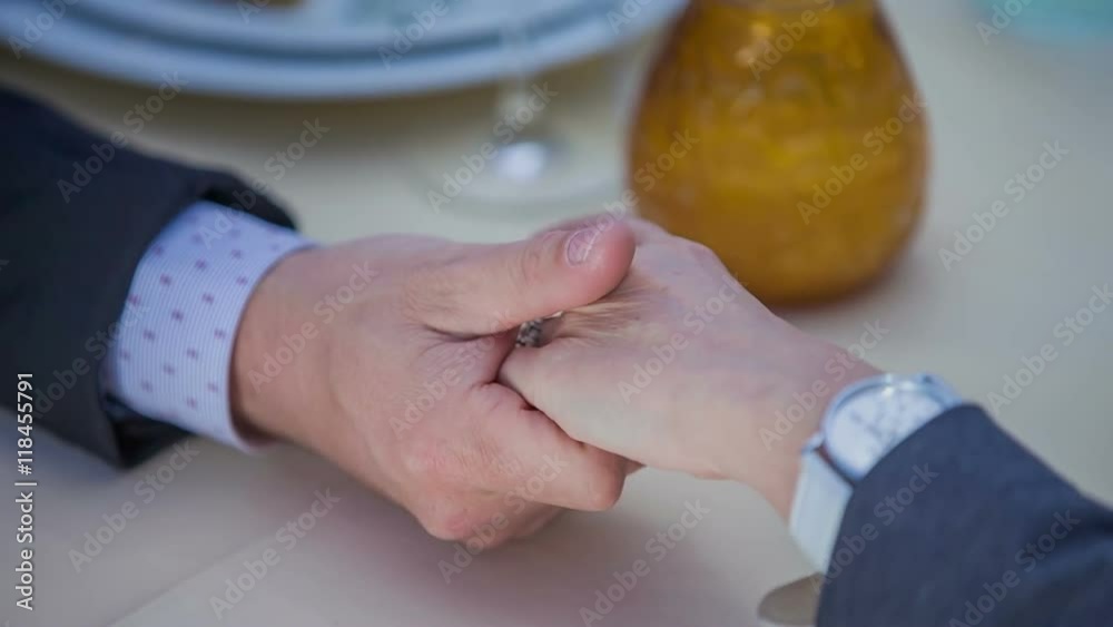 A man and woman's hands meet and then they are separating them. The woman checks her watch and she is in a hurry and will leave soon. Close-up shot.
A man and woman's hands meet and then they are separating them. The woman checks her watch and she is in a hurry and will leave soon. Close-up shot.