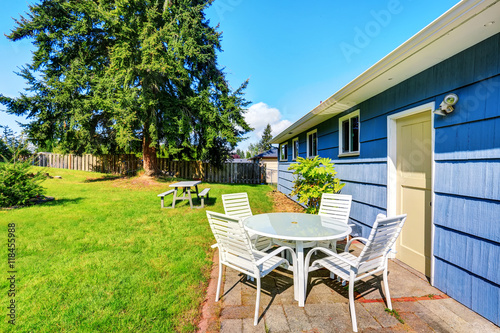 View of patio table set in the blue house back yard.