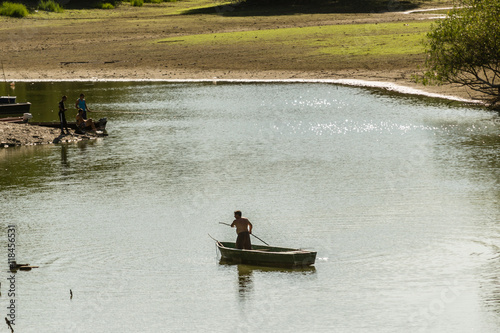 Fisherman in the branch of the Danube River