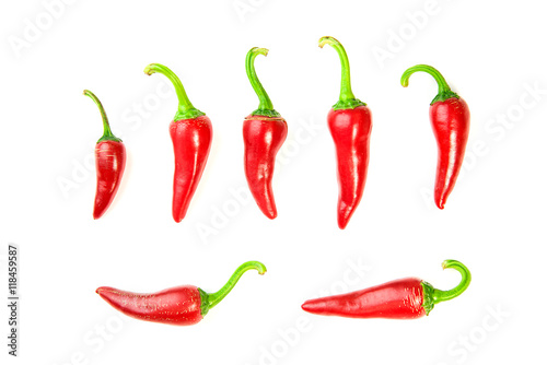Many ripe red  Chilli peppers on white
