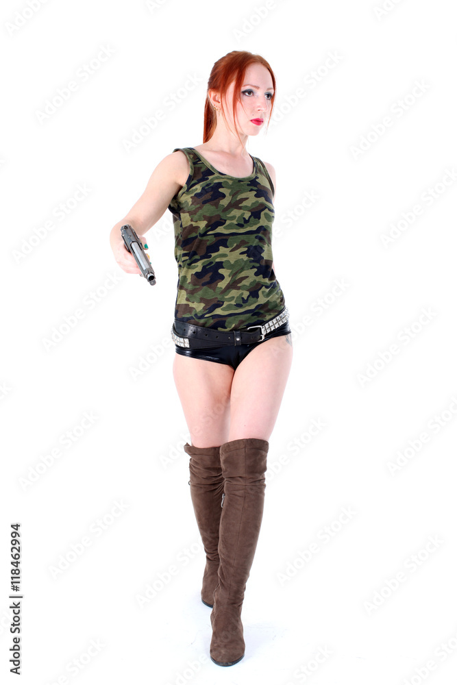 Fototapeta premium Walking beautiful Woman holding Handgun