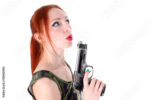 Young beautiful Woman holding Handgun © konstantant